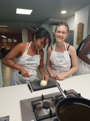 Two of my classmates cooking.