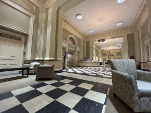 A library lobby with black and white checkered floors