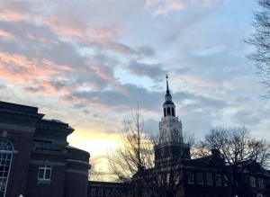 Baker Tower in front of a pale pink sunset