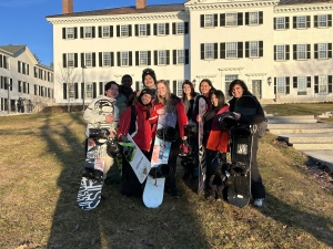 Lili and snowboarding classmates standing in front of Dartmouth Hall