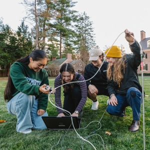 A photo of students working on a climate research project