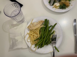 a picture of green beans and white spaghetti on a plate.