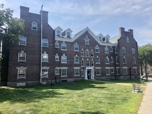 Wheeler Hall at Dartmouth College, a four-story brick dormitory building. Constructed in 1898, its architecture has an old but distinctly charming feel. 