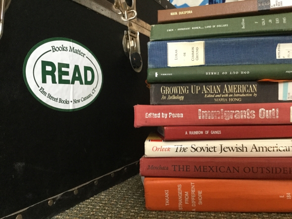 books next to trunk with sticker that says "read"