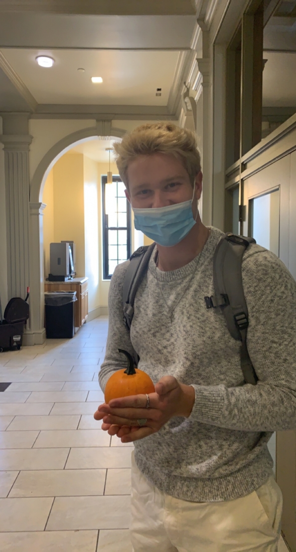 Boy holding pumpkin