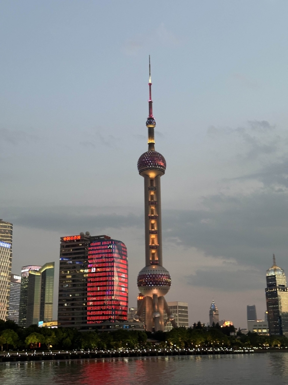 A photo of the Oriental Pearl Tower in Shanghai during the evening