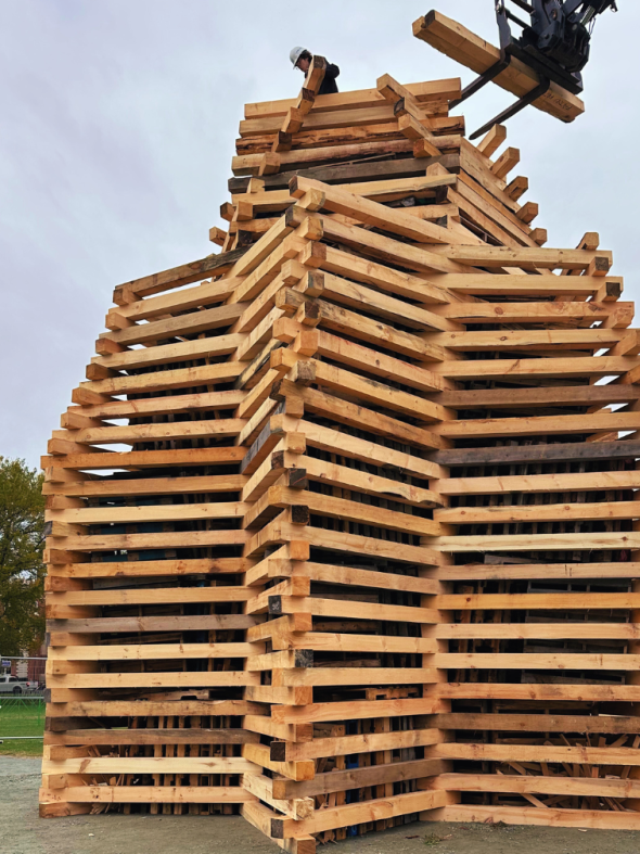 Homecoming bonfire building in progress