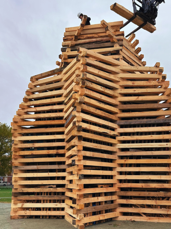 Homecoming bonfire building in progress 