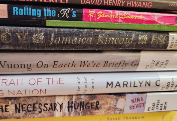 A photograph of a stack of 7 books