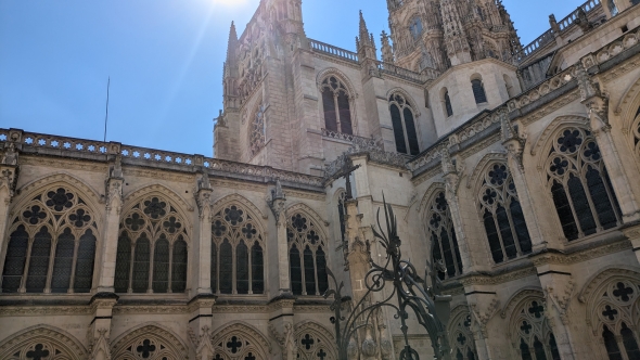 An 'outside' view of the cathedral from the inner courtyard. A bright blue sky is in the background.