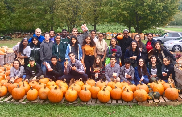 All smiles for FYSEP students after a successful apple-picking expedition!