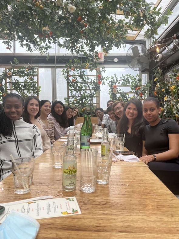 An image of our South House excursion group at our restaurant table about to feast