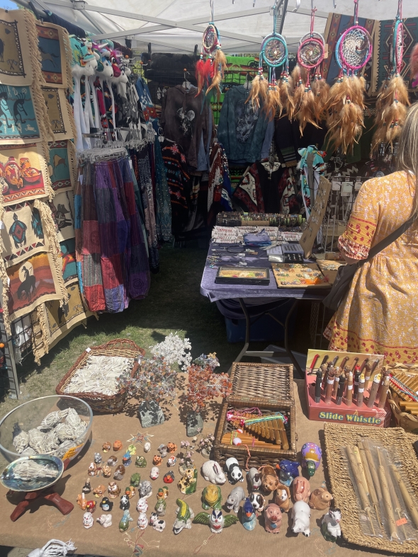 A Colorful Native American pop-up shop displaying hand-made Indigenous art and intricate beadwork