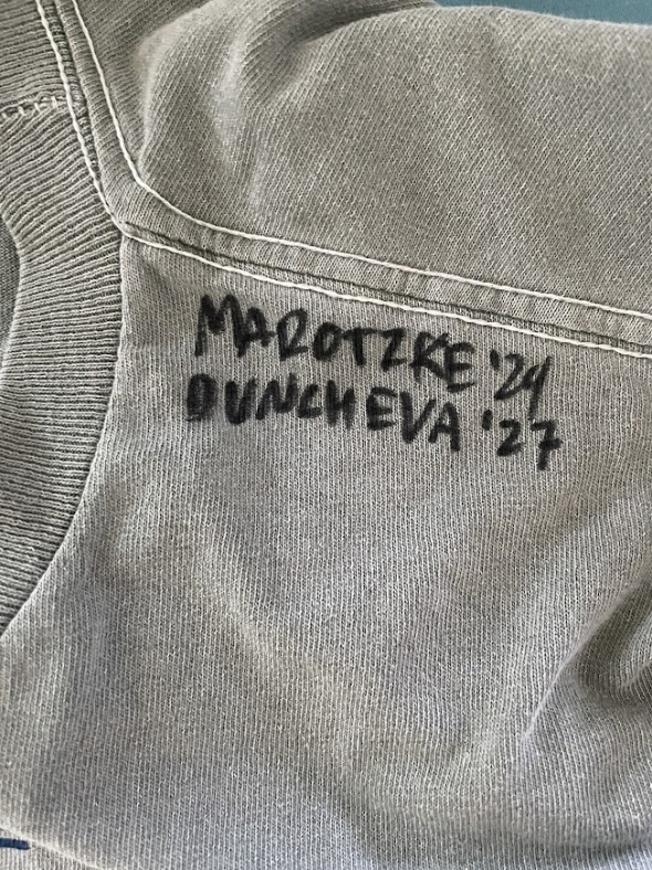 a picture of the shoulder of the shirt Kalina received with Ada's and Kalina's names