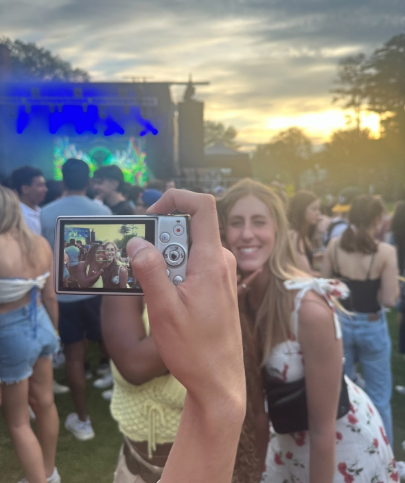 My friend Peyton and I having our photo taken on our friend's camera in the middle of Green Key's concert crowd.