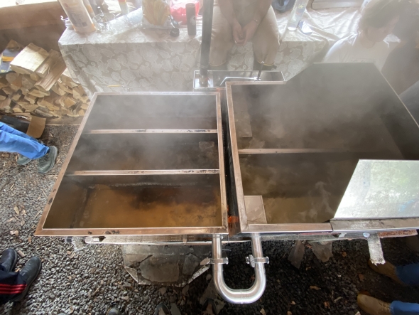 A maple sugaring evaporator steaming.