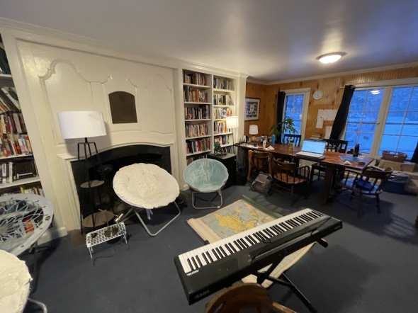 a picture of Alpha Theta's library: a map on the floor, surrounded by chairs