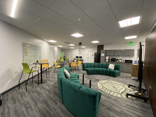 A view of Venture Studio, a modern workspace and meeting area with colorful furniture. 