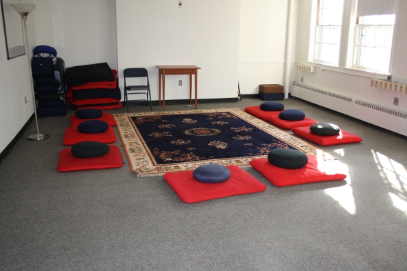 Meditation Room in North Fairbanks focused on the half of the room that is set up with a Buddhist cushion arrangement
