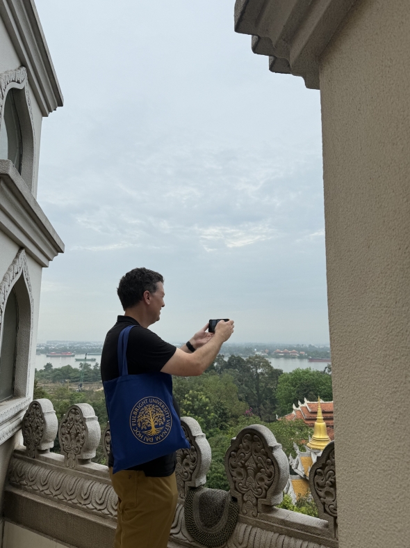 Professor Miller taking a photo from the view of the Buu Long Pagoda