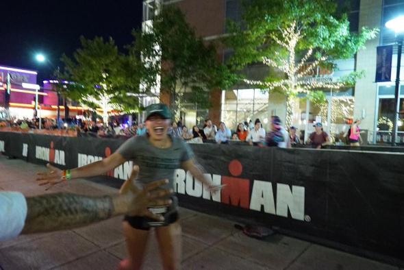 girl running through finish line