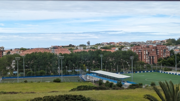 This is the view from Lily's bedroom in Spain. There is a park with lots of natural vegetation, a couple of soccer fields, and the ocean on the horizon.