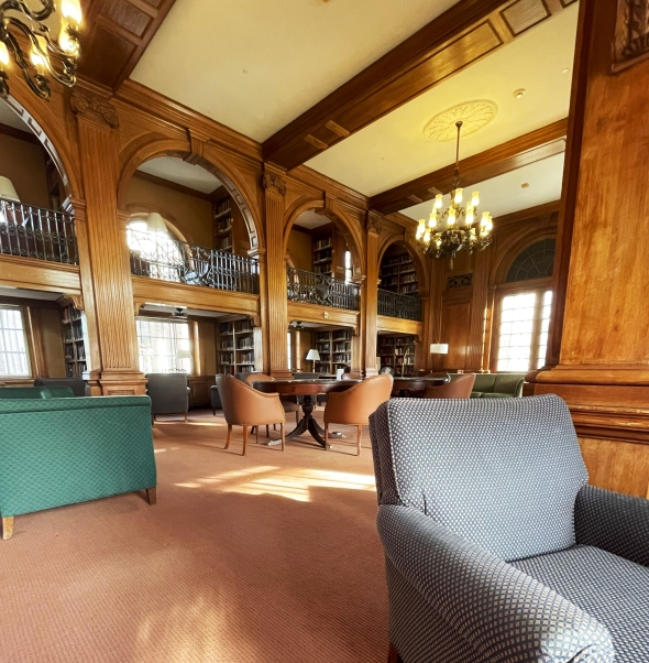 a view of sanborn library: cozy sofas under bright chandeliers 