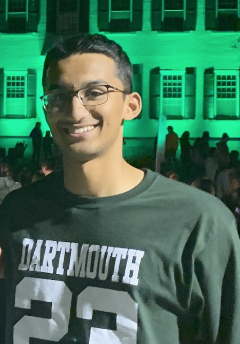 Breggy '23 wearing a class shirt in front of Dartmouth Hall