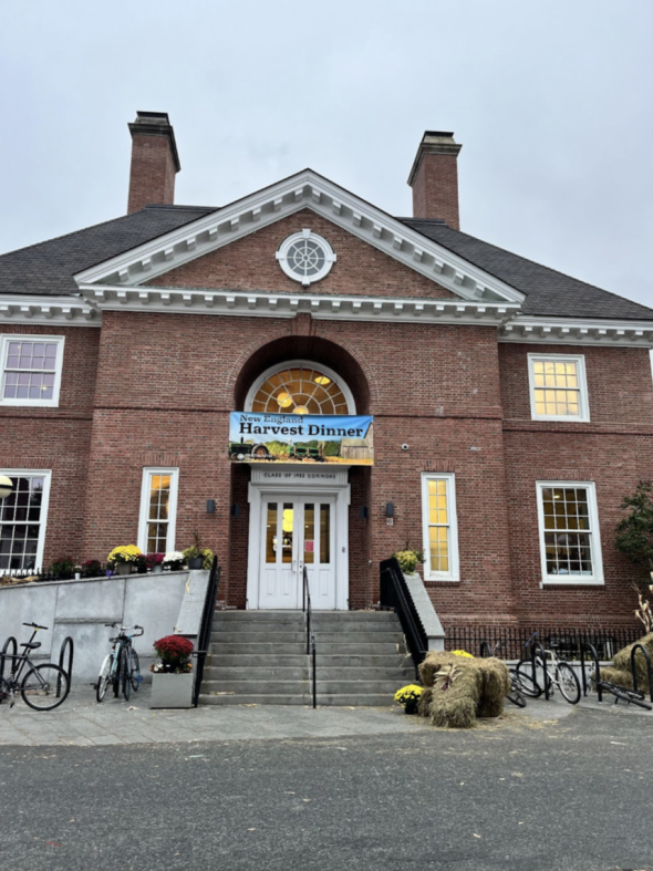 The front of FoCo on an overcast day, with a "Harvest Dinner" banner above the door.