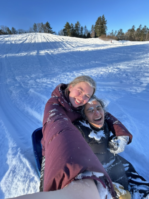 two people smiling in the snow