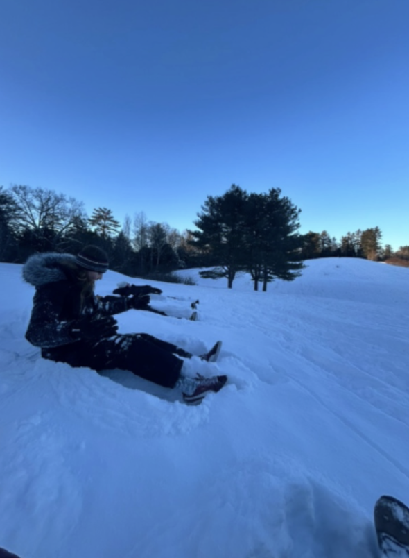 people sitting in the snow
