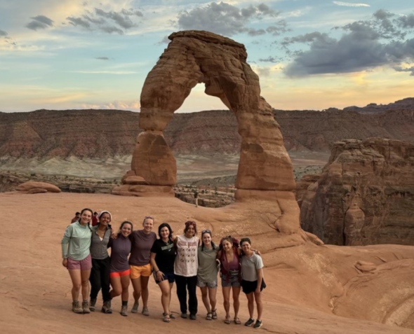 Photo of my trip posing in front of the iconic delicate arch in Utah!