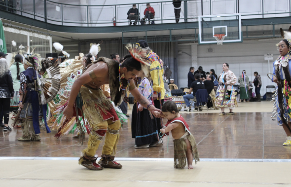 Photo of a baby dancing in the circle.