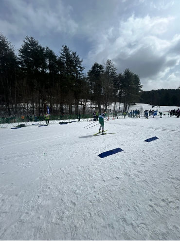 a skier crossing the finish line