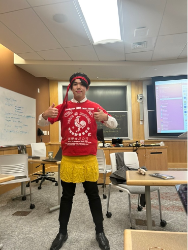a person with a red top and yellow skirt