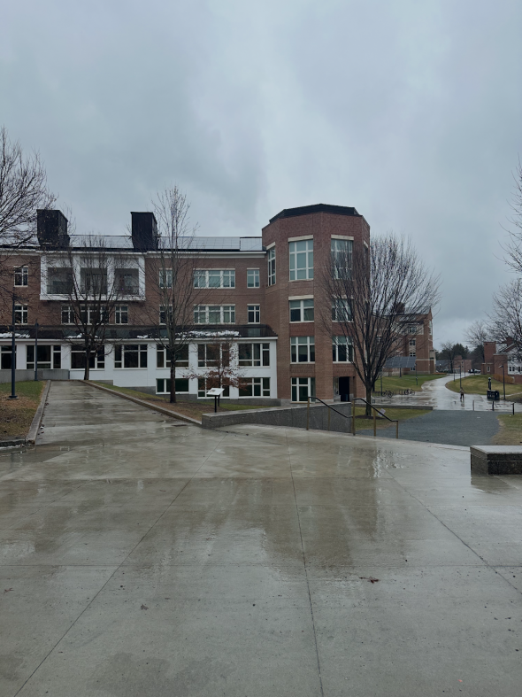 Picture of a brick building in rainy weather.