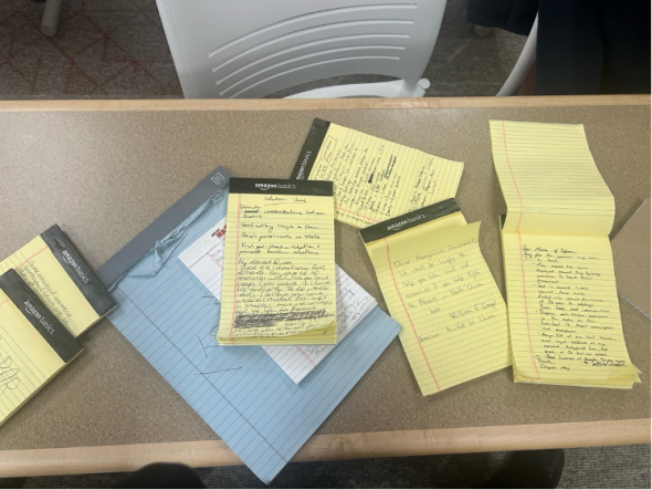 a pile of notepads on a table