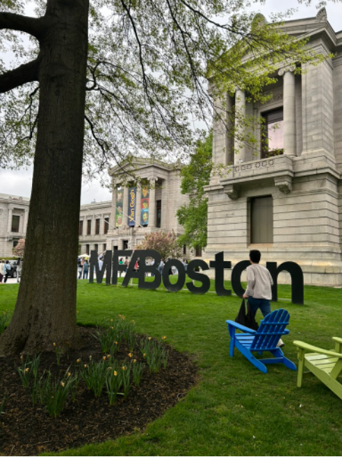 a sign reads 'MFA Boston' in front of the museum