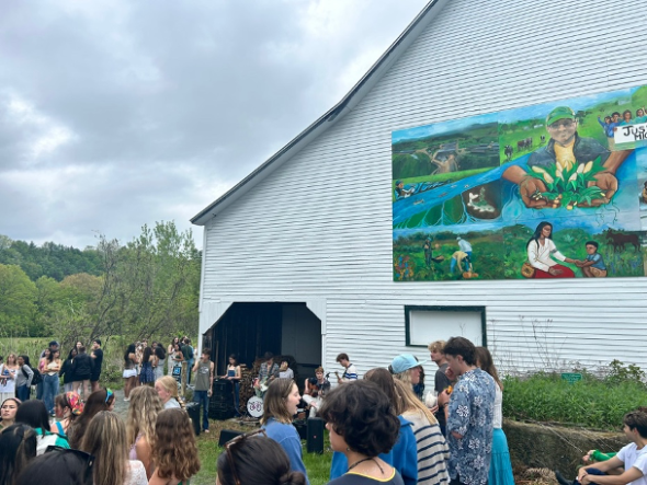 a barn with a band playing in front of it
