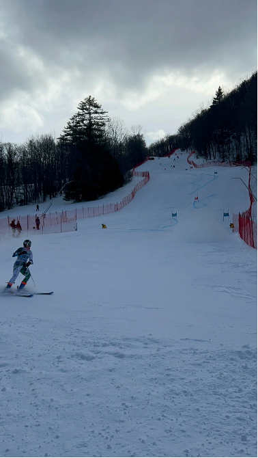 a person skiing down a ski slope