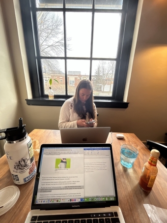 Girl Doing Homework at a Coffee Shop