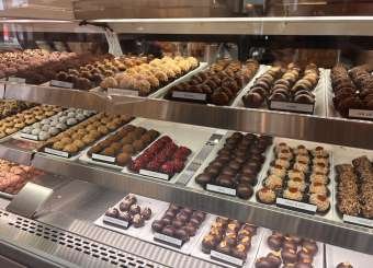 Different types of chocolate truffles on display.