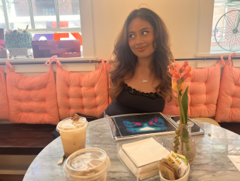 Picture of the blogger's friend sitting across from them, smiling