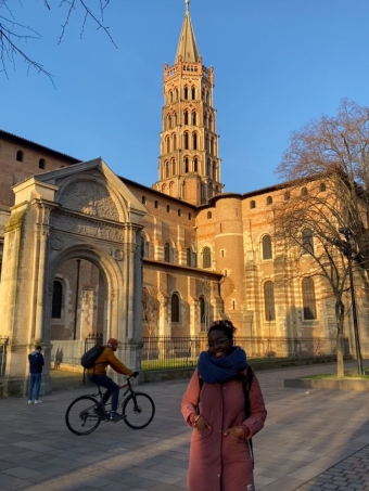 A picture of me standing in front of the basilique Saint-Sernin, an important and historic catholic church in Toulouse. 