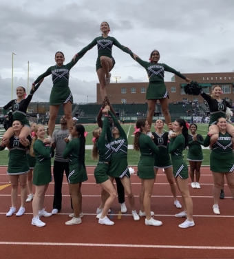 My cheer team doing a stunt pyramid.