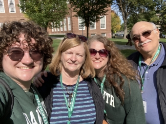 a selfie of me, my mom and my grandparents in front of baker-berry library