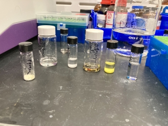 a set of vials with solutions of varying colors