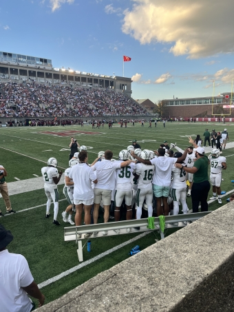 The Dartmouth football team celebrating after a successful play